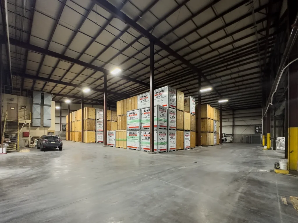 Large assortment of boxes being stored inside large warehouse rental space